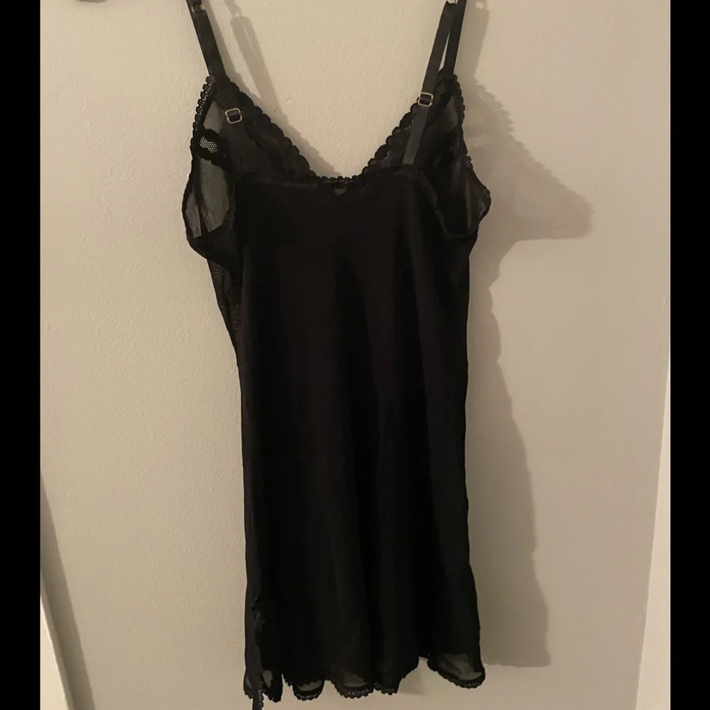Sheer black negligeé with lace trim